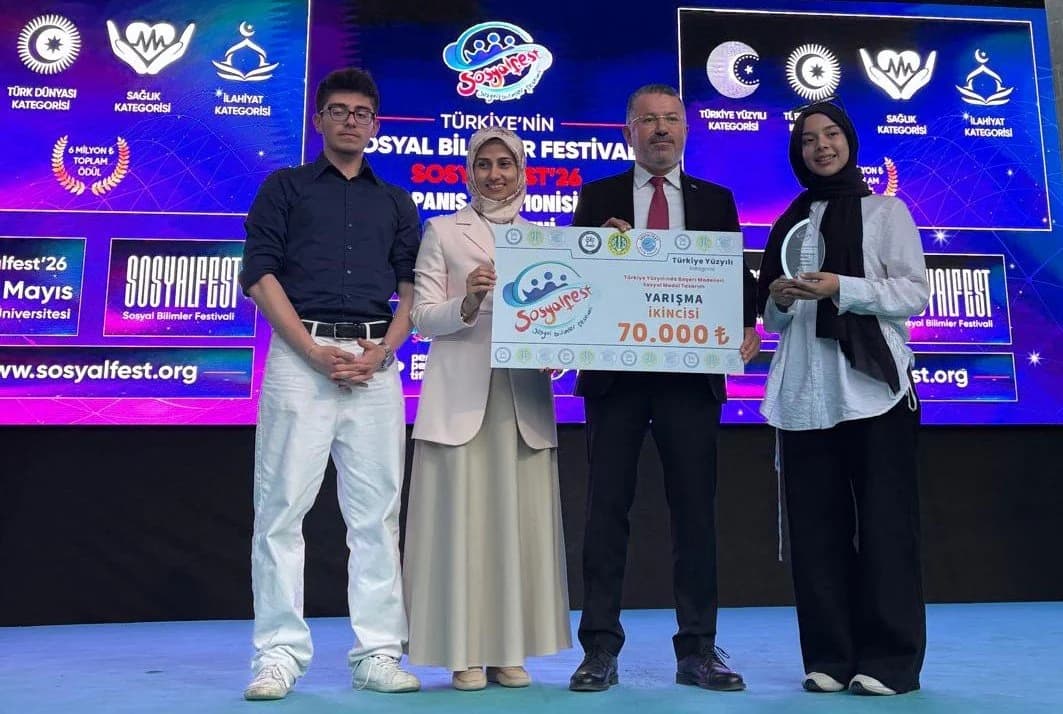 SosyalFest 2026 award-stage photograph with a team holding a Turkey-wide second-place placard